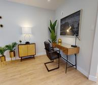 18 McQuillan Lane Townhouse - Monthly townhome rental in Bedford office area with wood desk and black chair - Premiere Suites