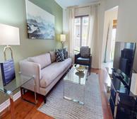 Beacon Hill South II - Ottawa fully furnished home living room with grey couch and glass coffee table - Premiere Suites