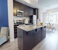 Rockcliffe Village - Ottawa pet-friendly rental townhouse kitchen and dining room with glass dining table - Premiere Suites