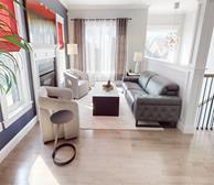 86 Cherrywood Drive - Extended stay apartment in Dartmouth living room with grey couch and white armchairs - Premiere Suites