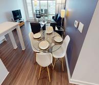 Westboro Connection 2 - Ottawa fully furnished apartment dining room with glass dining table and white chairs - Premiere Suites