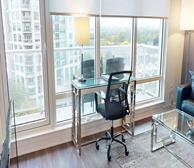 Westboro Connection 2 - Serviced apartment in Ottawa office workspace with large windows and view of the city - Premiere Suites