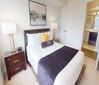 Circa II - Markham short-term rental apartment primary bedroom with private en-suite bathroom - Premiere Suites