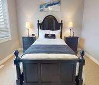 Balinroan Crescent - Ottawa family friendly townhouse rental primary bedroom with queen bed and Premiere Suites pillow